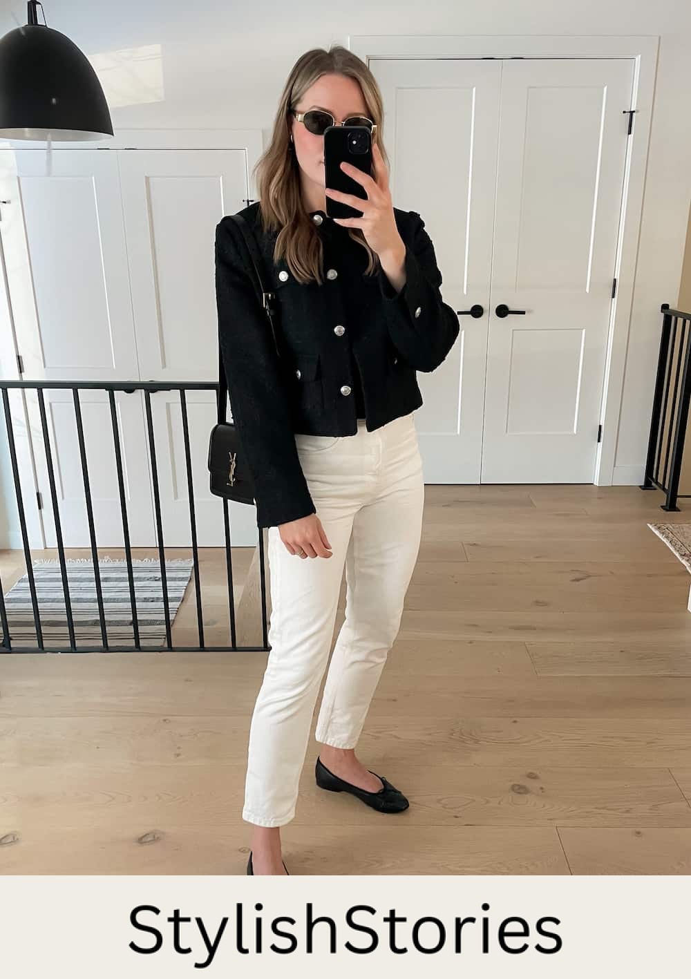 woman wearing a spring capsule wardrobe outfit with an black tweed lady jacket, black top, off-white jeans, and black ballet flats