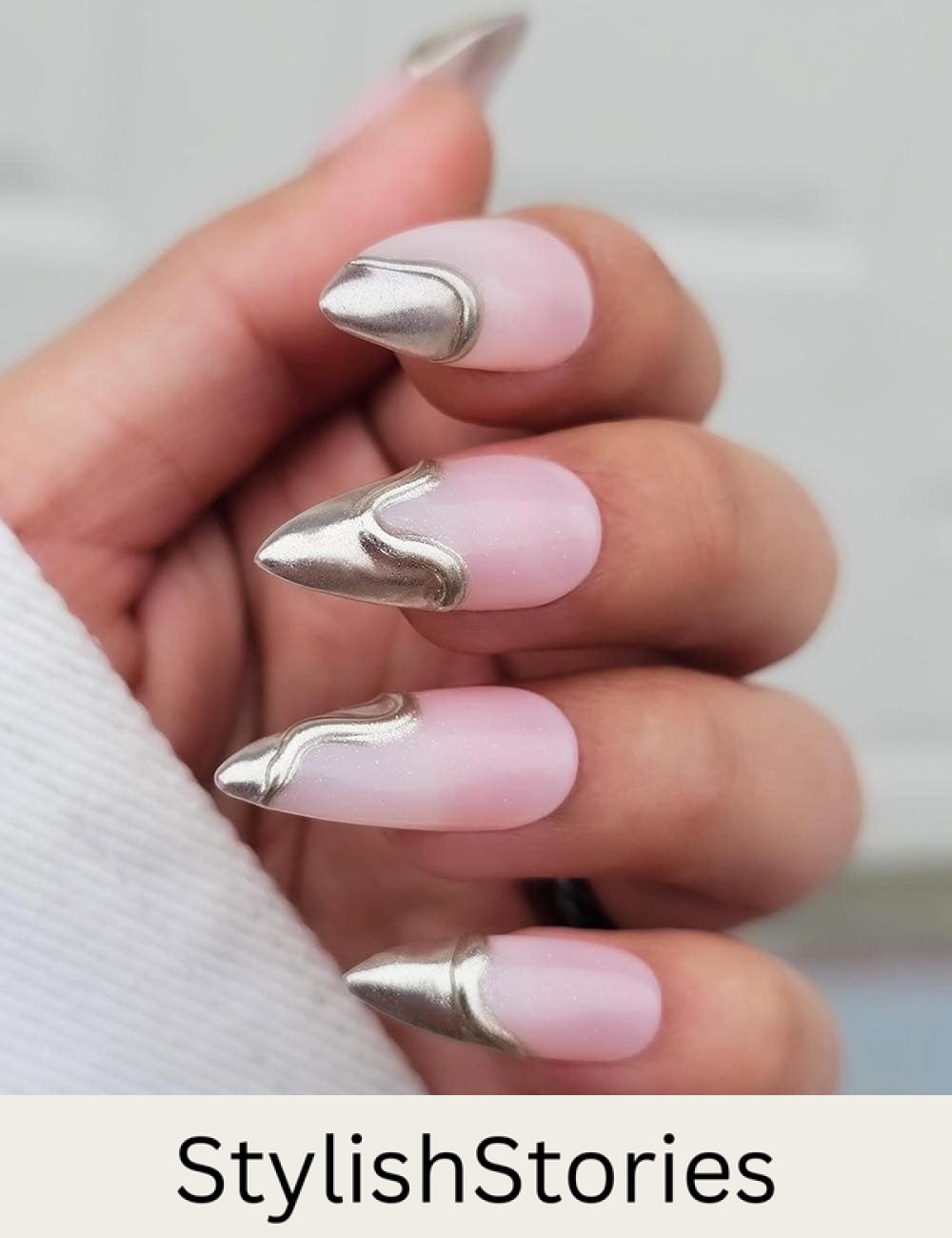 long nude pink stiletto nails with metallic silver dripping tips
