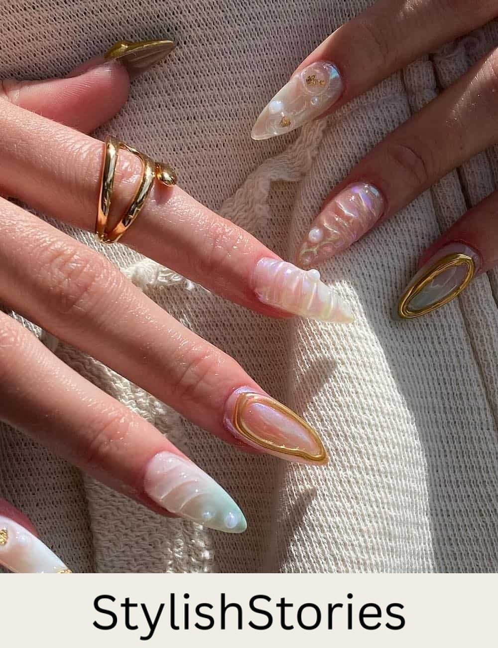 long almond nails with 3D ocean-inspired nail art with gold accents