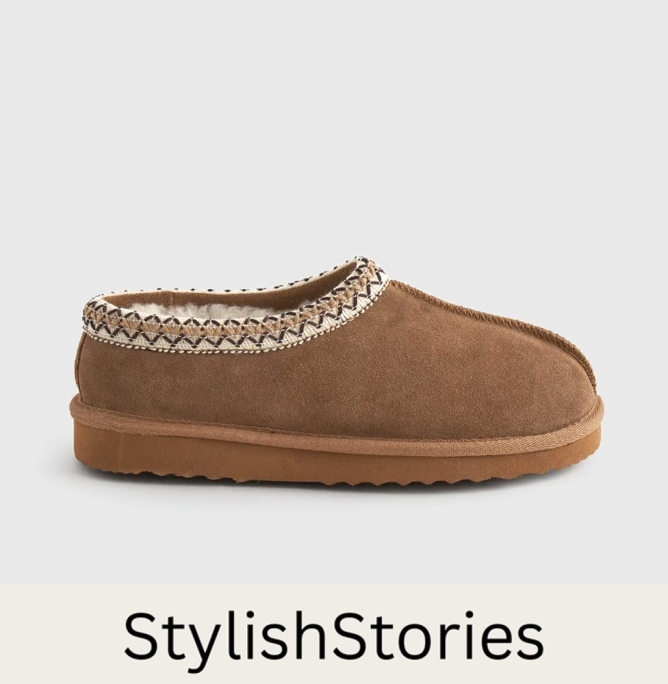 image of a shearling slipper with stitching around the edge that is a dupe of the Ugg Tasman slipper