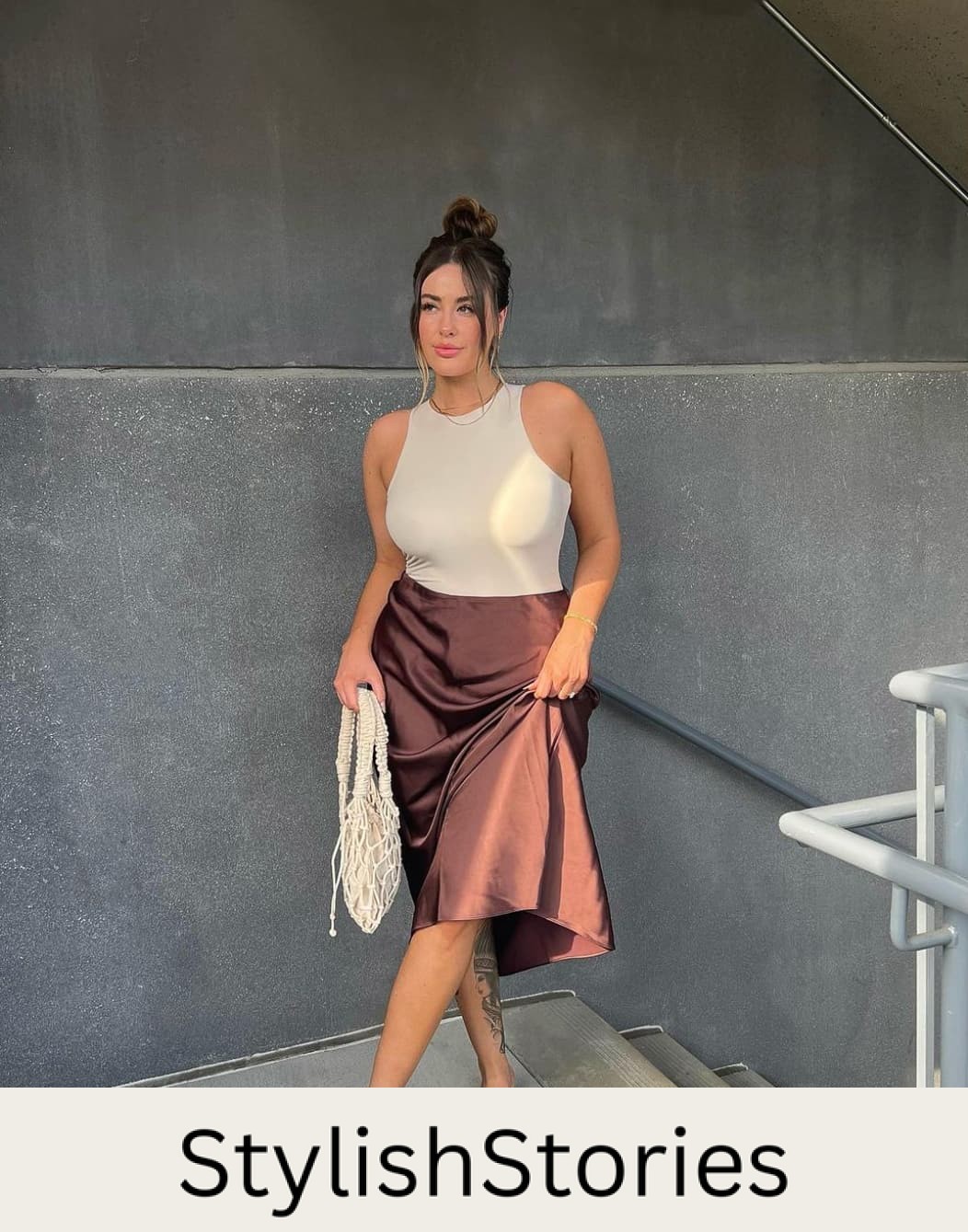 woman wearing a tan body suit with a brown silk slip skirt and tan sandals