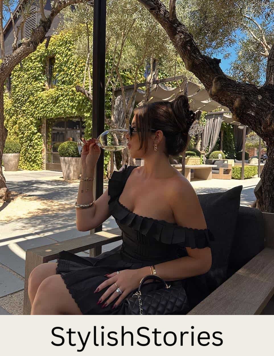 woman wearing a black dress at a winery