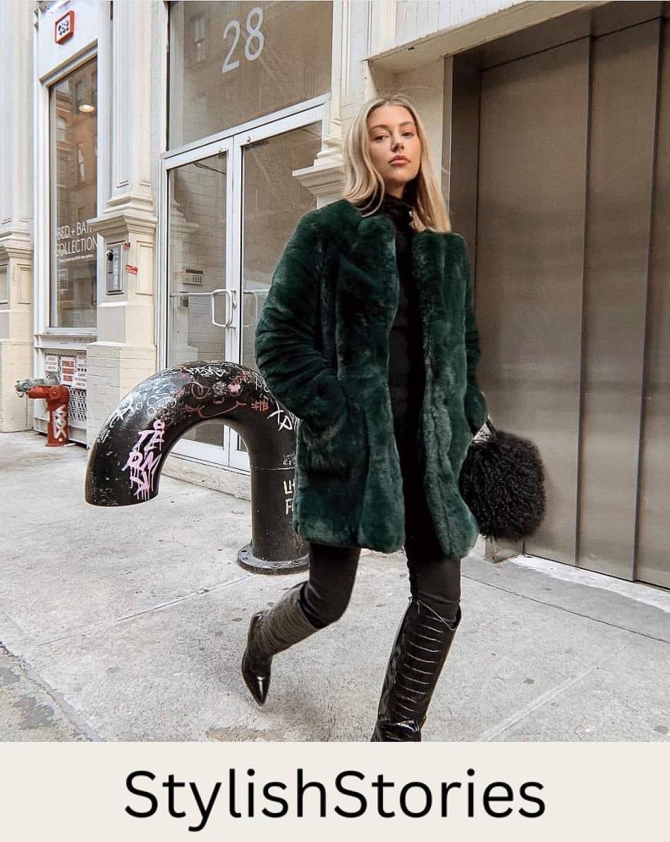 woman wearing a green faux fur coat with black pants and knee-high black croc-effect boots