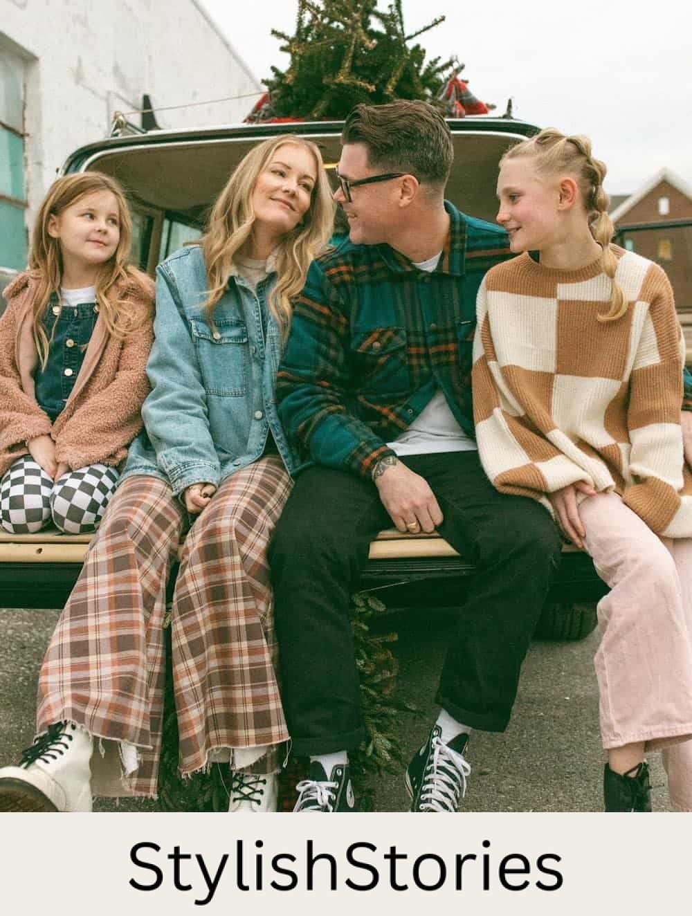 a winter family photoshoot with outfits featuring plaid, checkerboard, flannel, and other retro-inspired styles