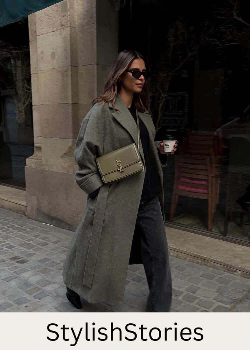 Woman wearing jeans and a long oversized coat with booties.