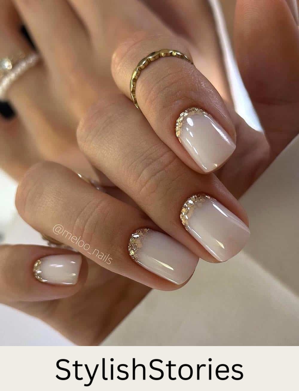 short milky nails with chunky glitter reverse french tips