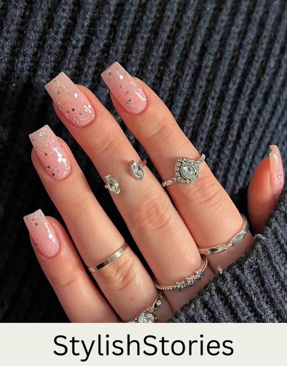 medium length pink nails with chunky silver glitter