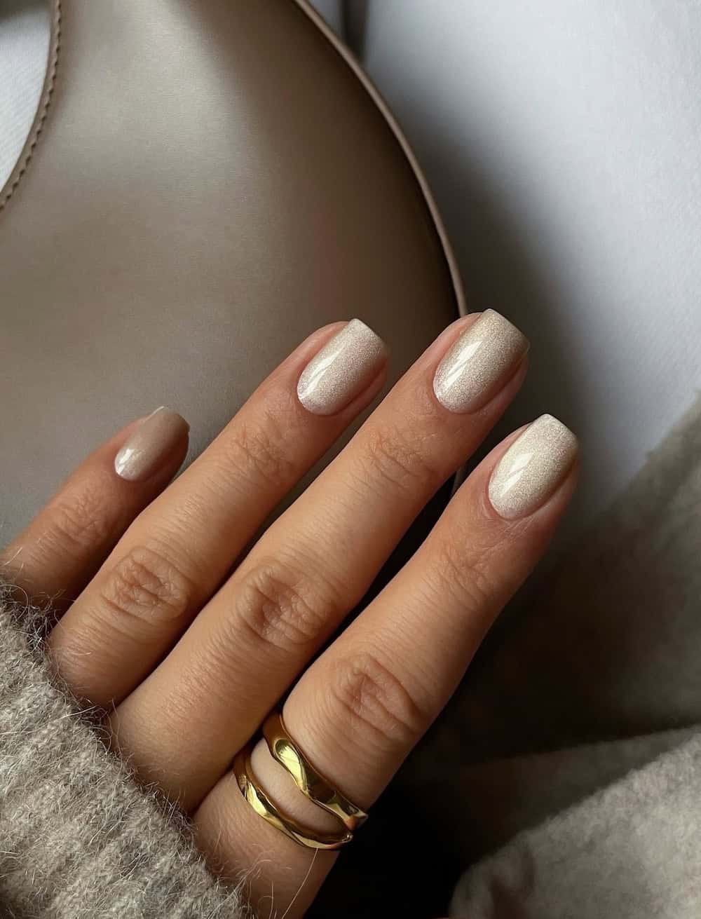 short square nails with pearly champagne polish