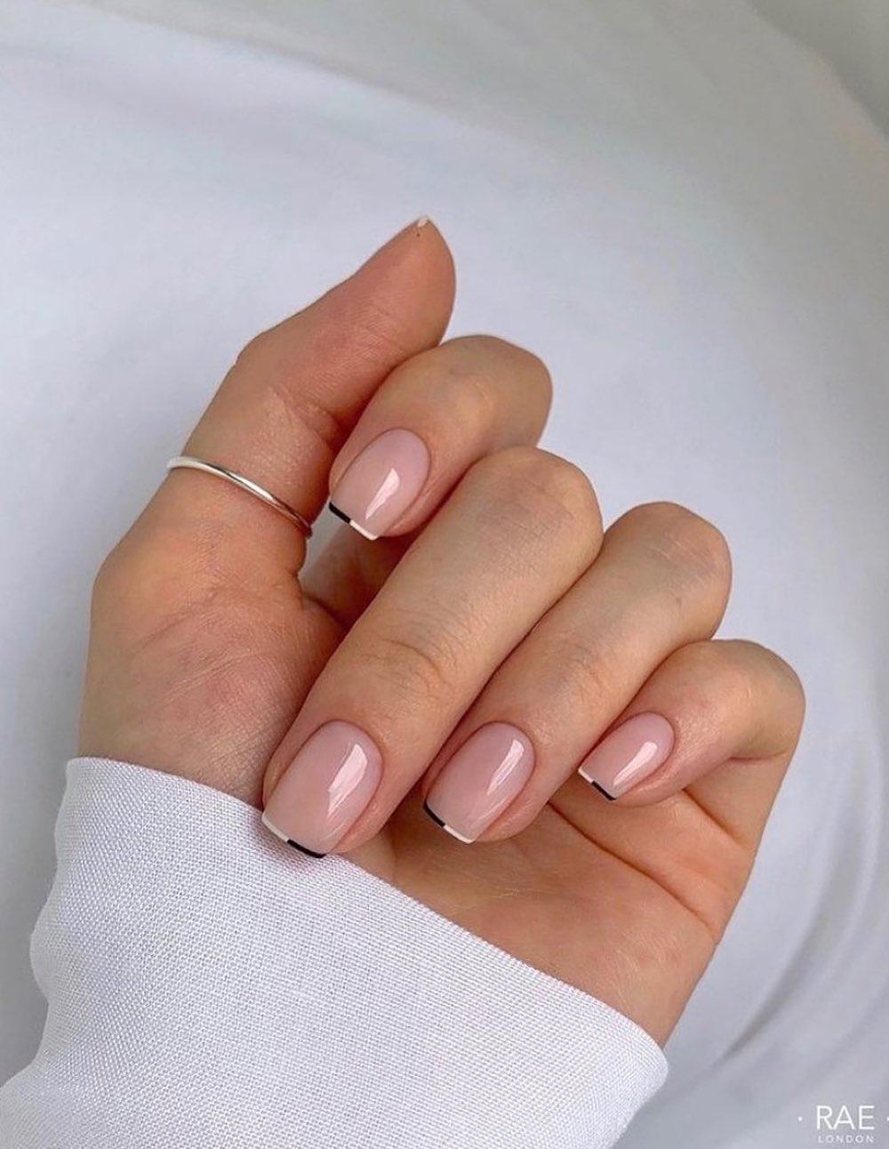 short nude nails with two tone french tips