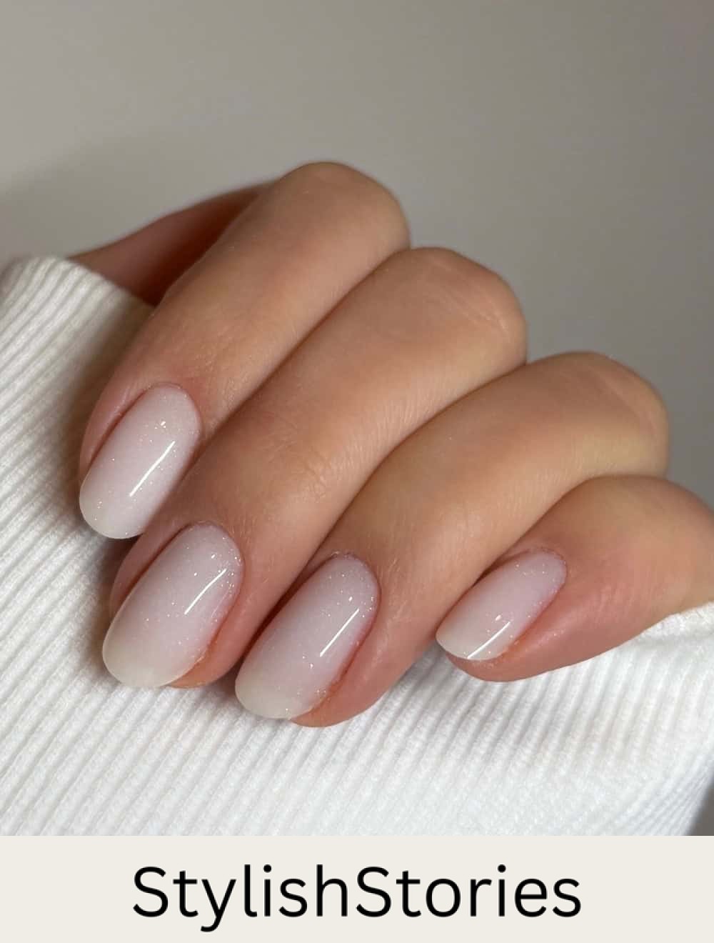 short milky white nails with glittering topcoat