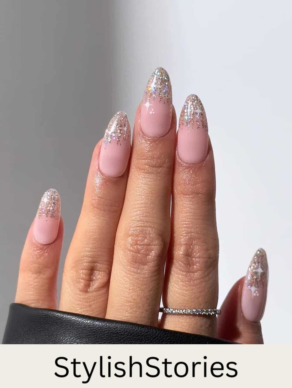 long nude pink almond nails with silver glitter ombre tips