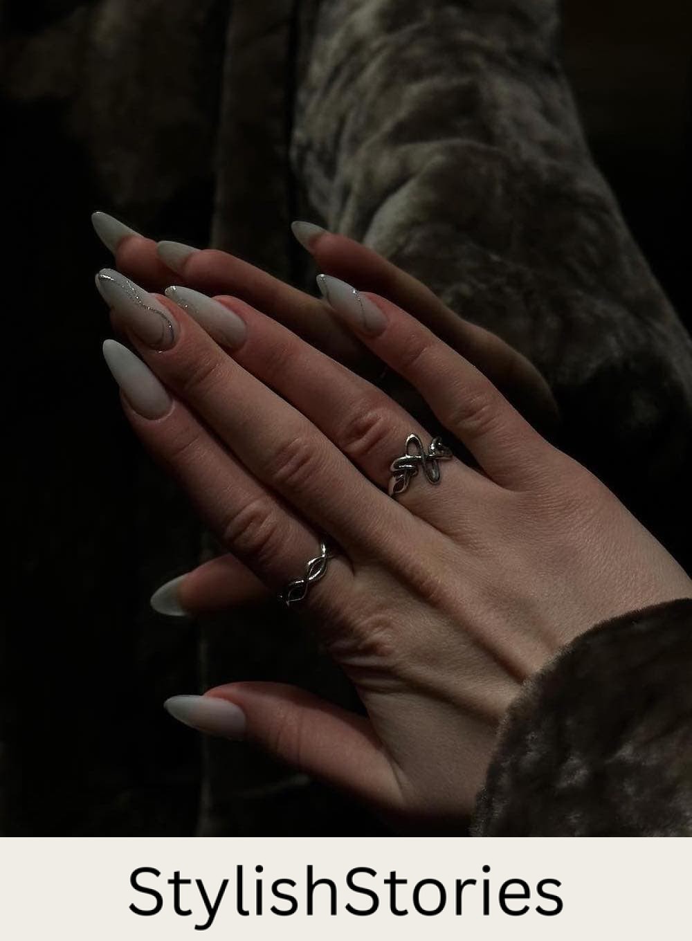long milky white nails with silver waves