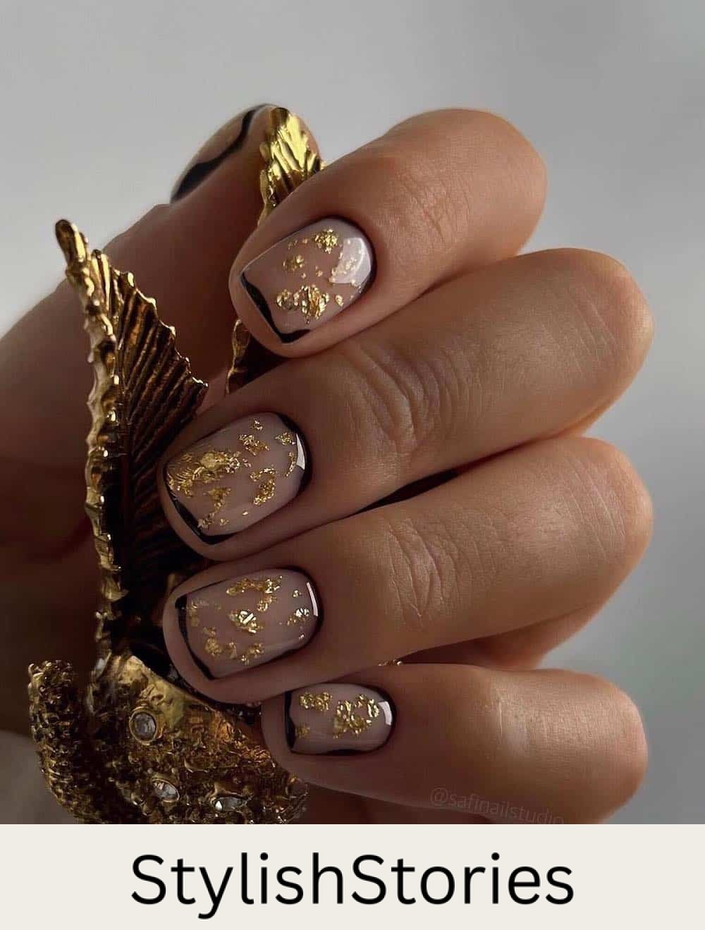 nude nails with gold foil and black borders