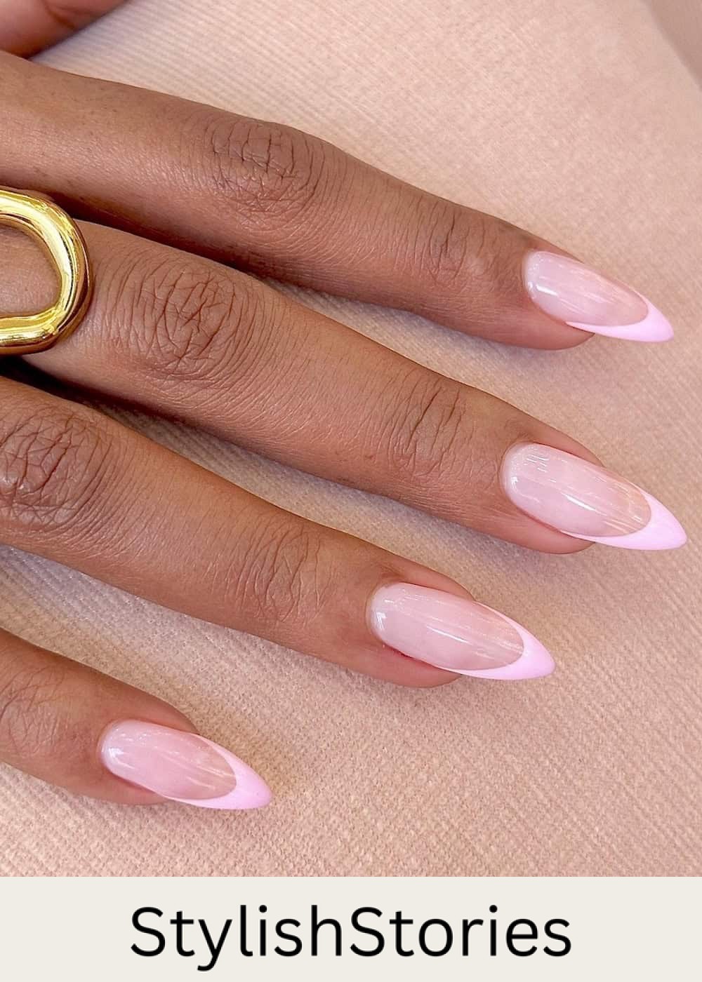 long pointy almond nails with soft pink polish and pink tips