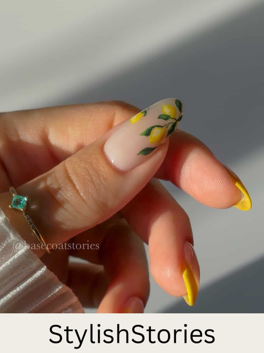 nude almond nails with yellow tips and lemon nail art