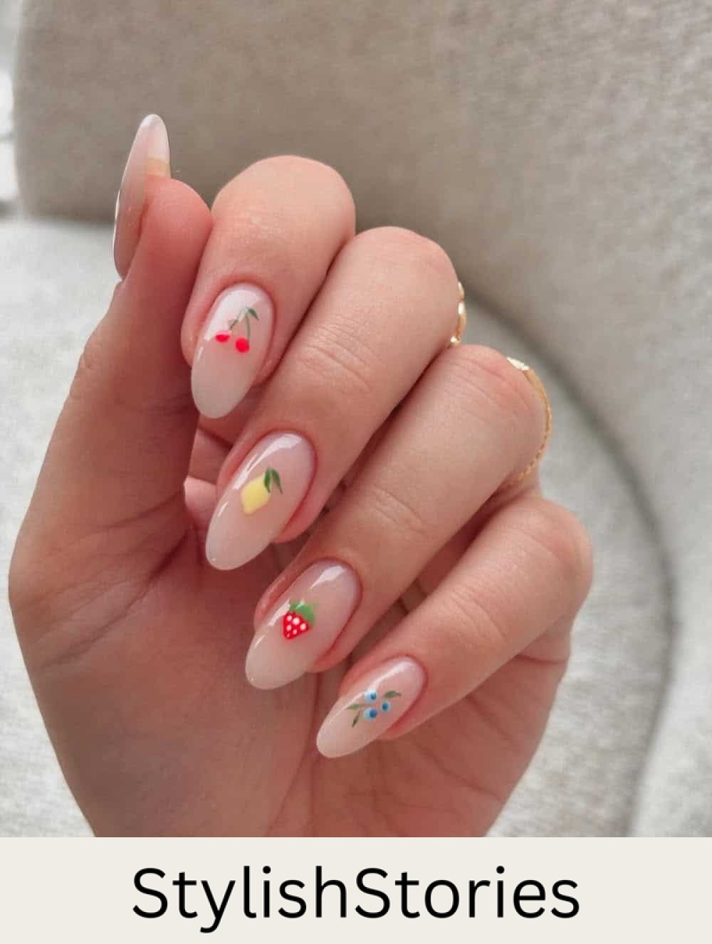 almond nude nails with spring fruit nail art