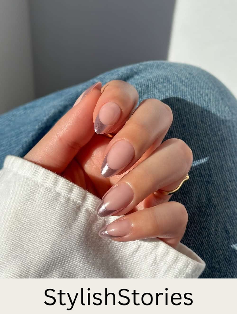 nude almond nails with metallic pink tips