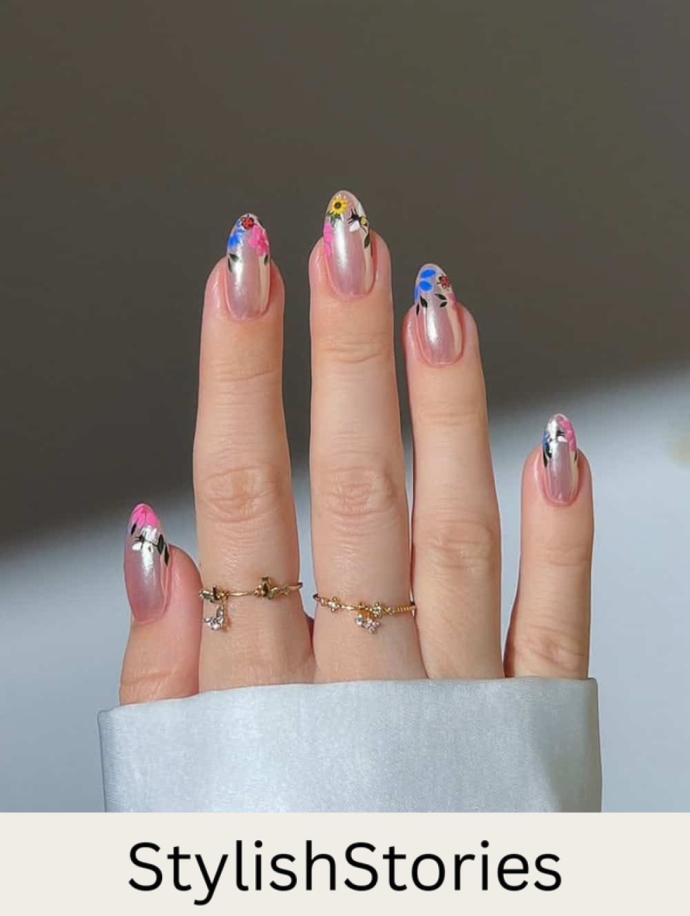 short metallic pink nails with floral tips