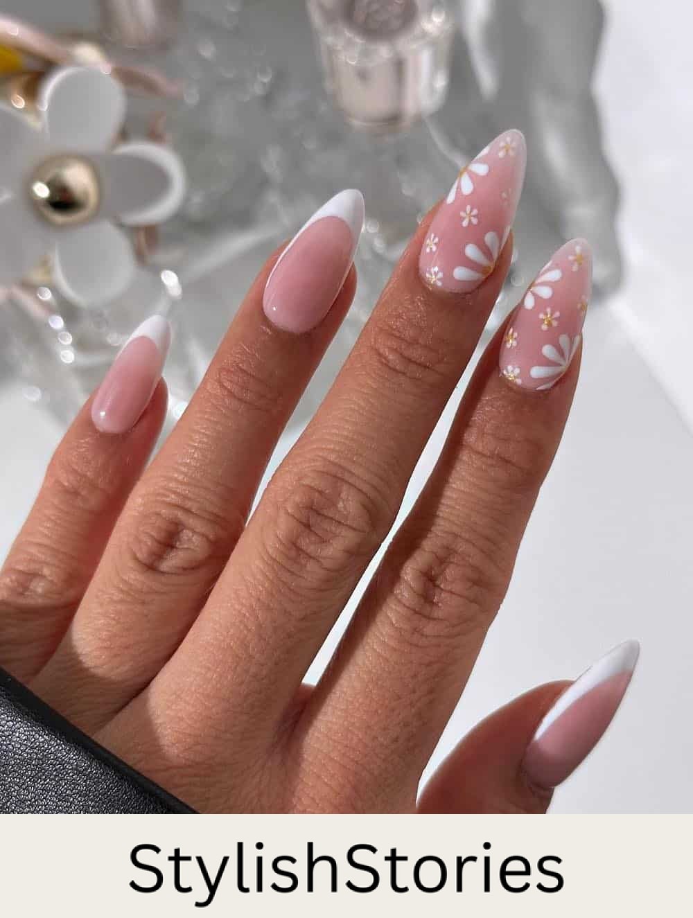 long nude pink nails with white tips and floral accent nails