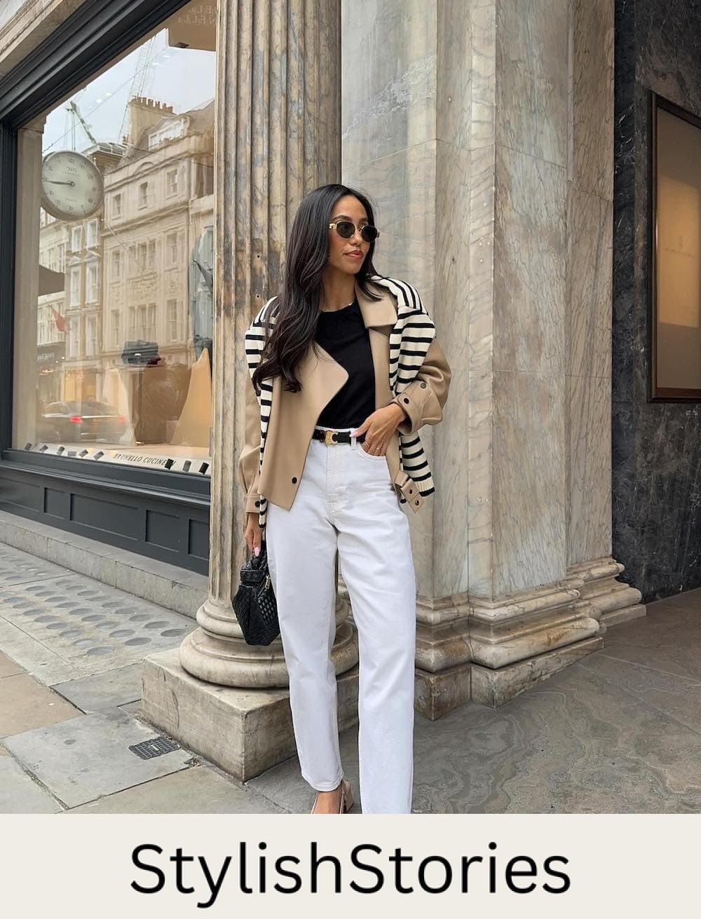 Woman wearing white jeans, a black tee, a cropped jacket and Mary Jane block heels.