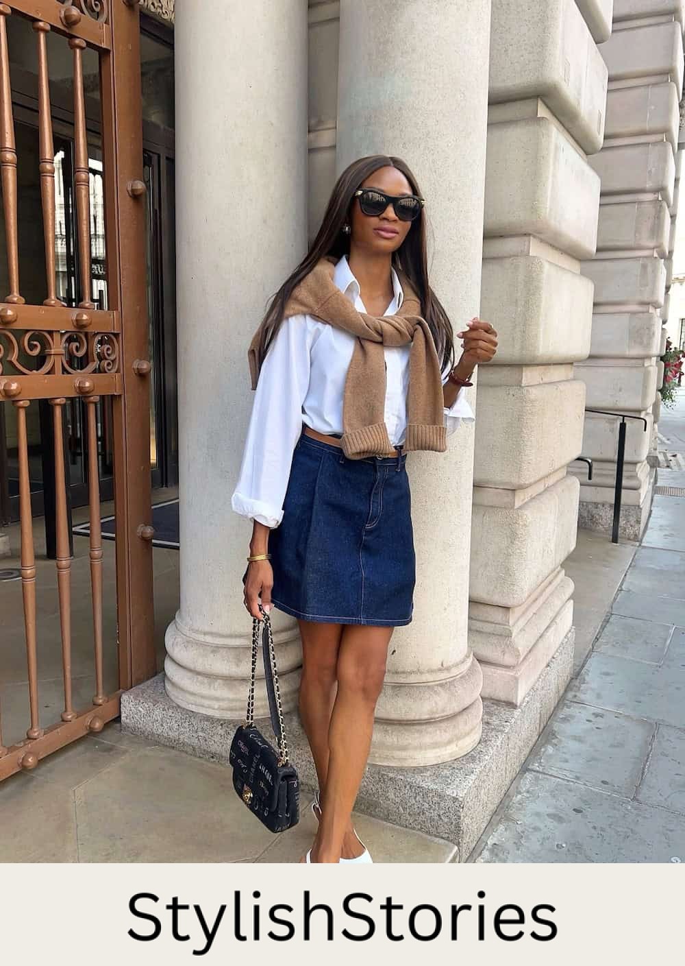 Woman wearing a denim skirt with a white button down and white sling back heels