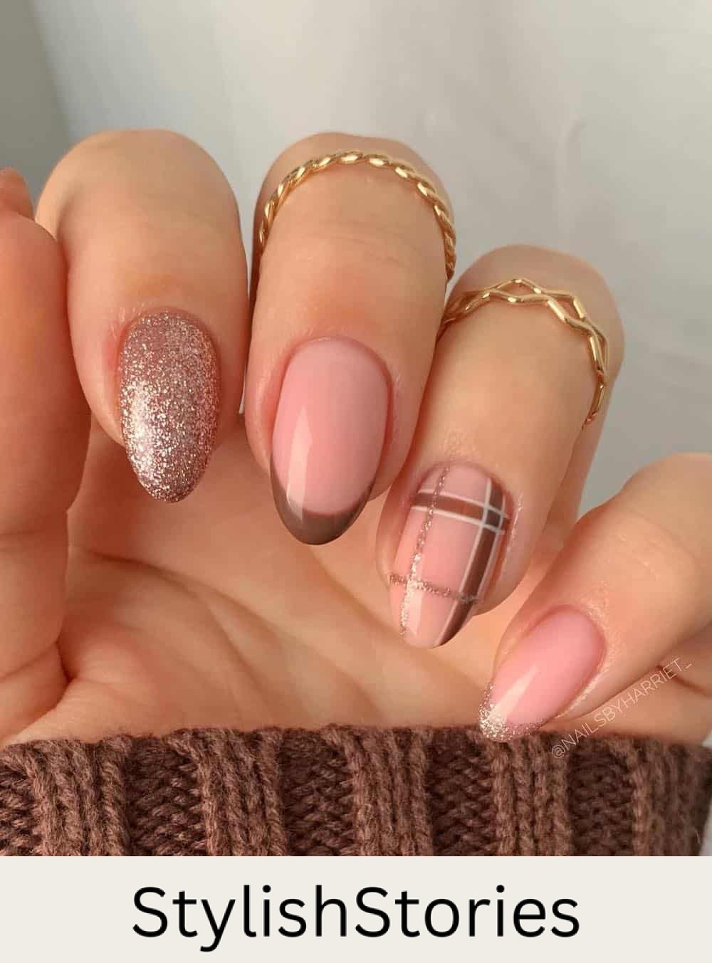 nude almond nails with plaid print, glitter polish, and french tips