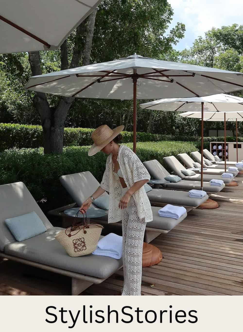 Woman wearing a white crocheted set at a resort.
