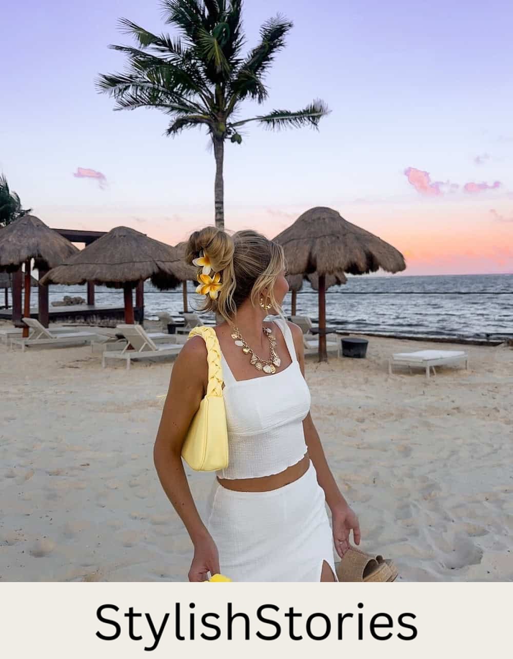 Woman wearing a white two-piece skirt set.