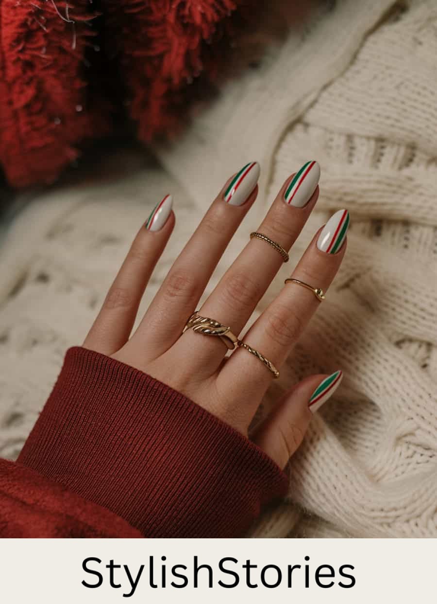 medium white almond nails with red and green vertical accent stripes