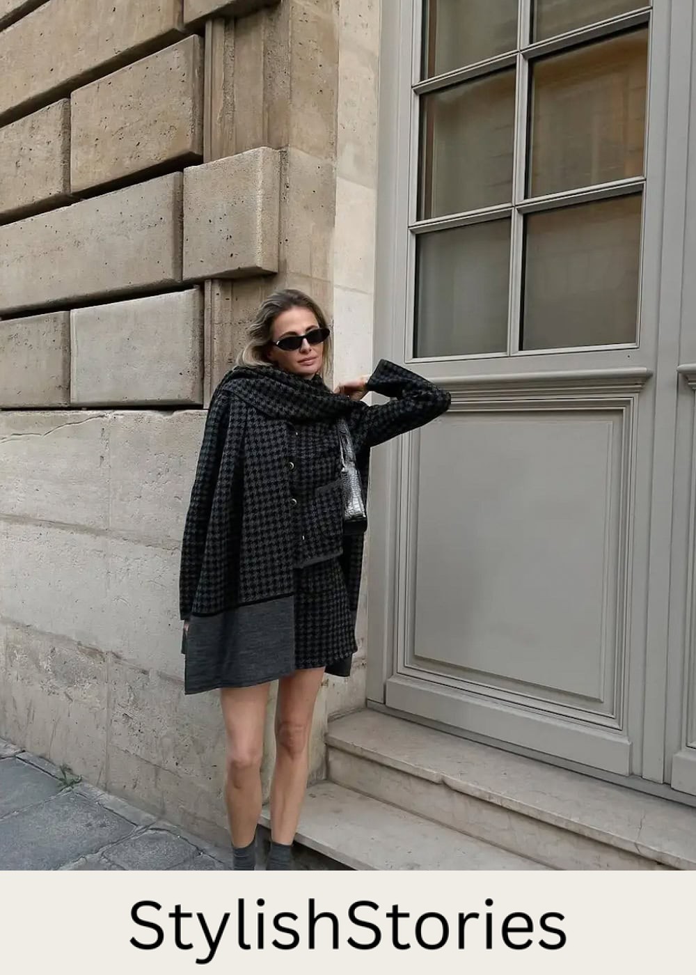 Woman wearing a plaid skirt set with mary jane shoes.