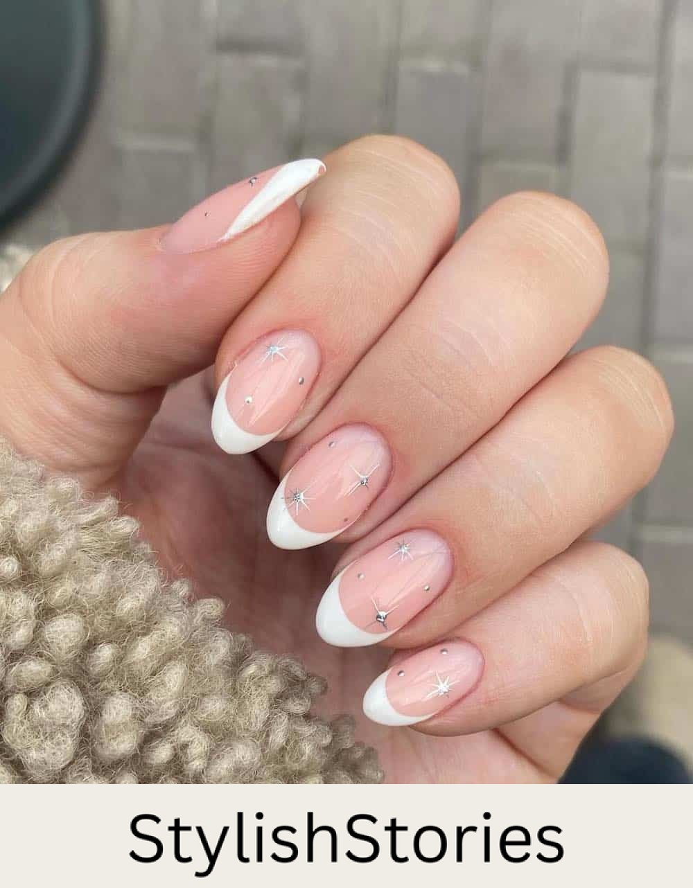 short nude nails with white tips and silver sparkles